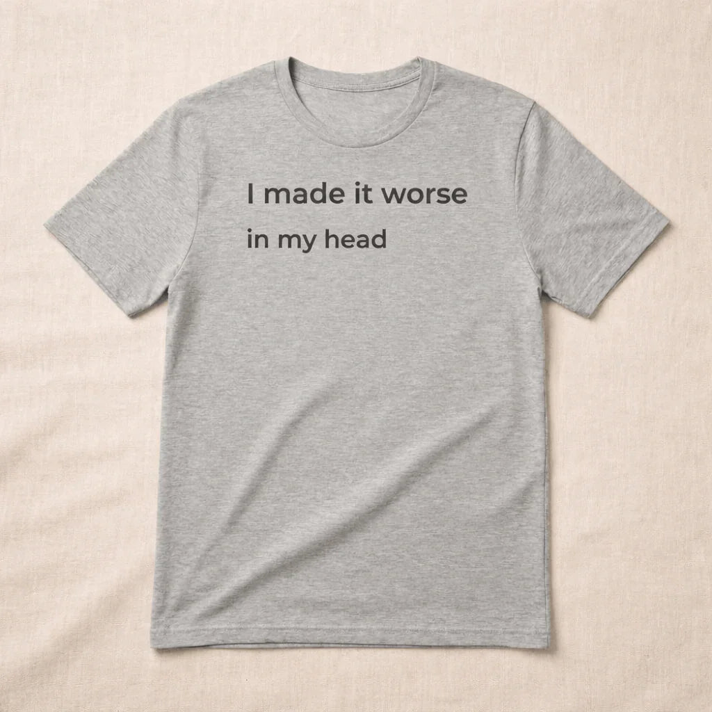 Minimalist t-shirt with “I made it worse in my head” text, soft neutral aesthetic