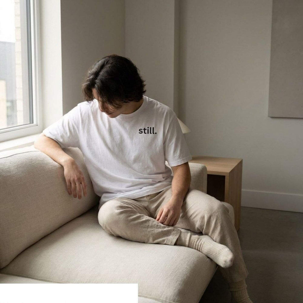 man wearing still t-shirt minimalist lifestyle calm neutral aesthetic outfit indoor