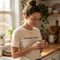 woman wearing i'll close it later natural white t-shirt holding coffee in kitchen — text & tone
