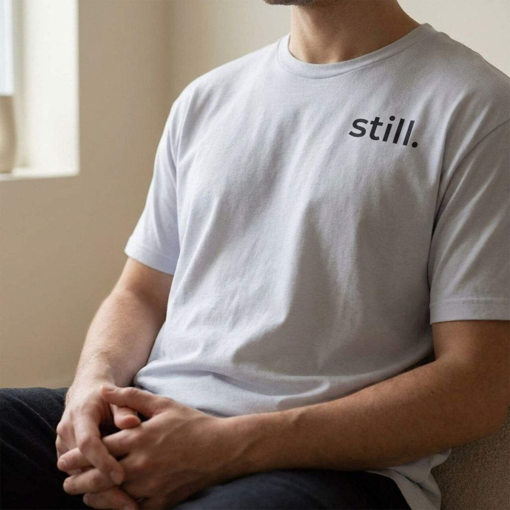close up man wearing still t-shirt minimal outfit soft neutral aesthetic clothing