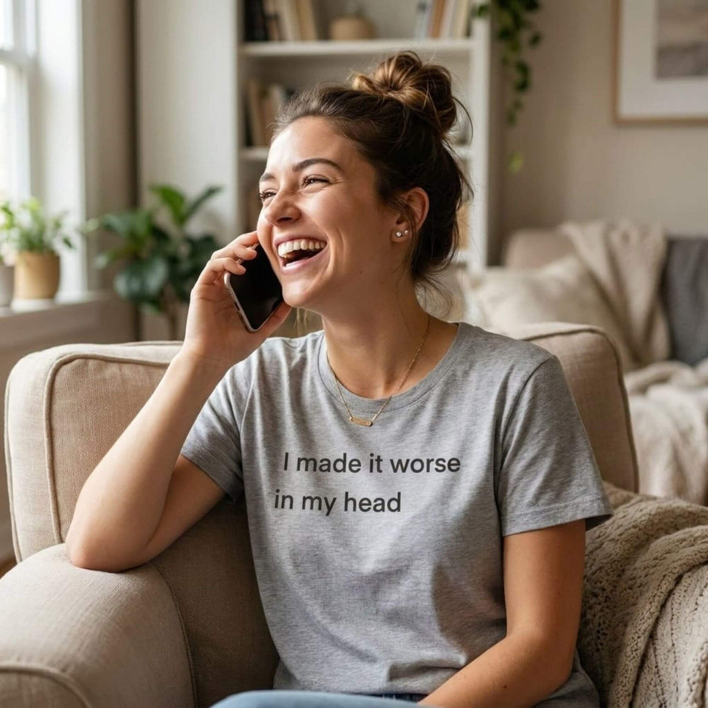 woman laughing on phone in i made it worse in my head white tee — text & tone