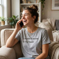 woman laughing on phone in i made it worse in my head white tee — text & tone