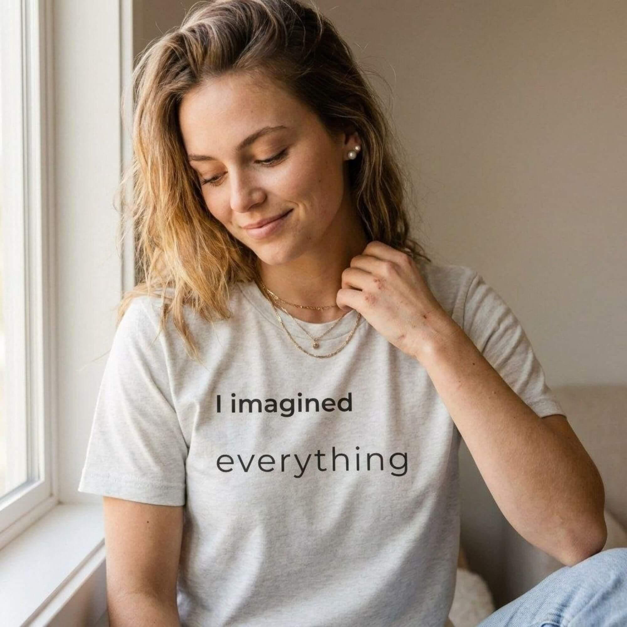 woman wearing i imagined everything natural white t-shirt by window — text & tone