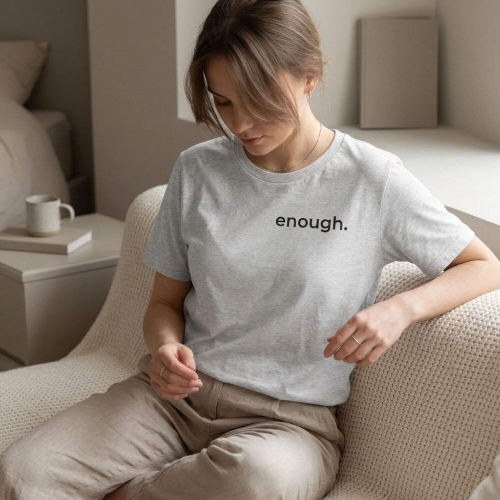 woman wearing enough t-shirt soft neutral aesthetic calm minimalist outfit indoor