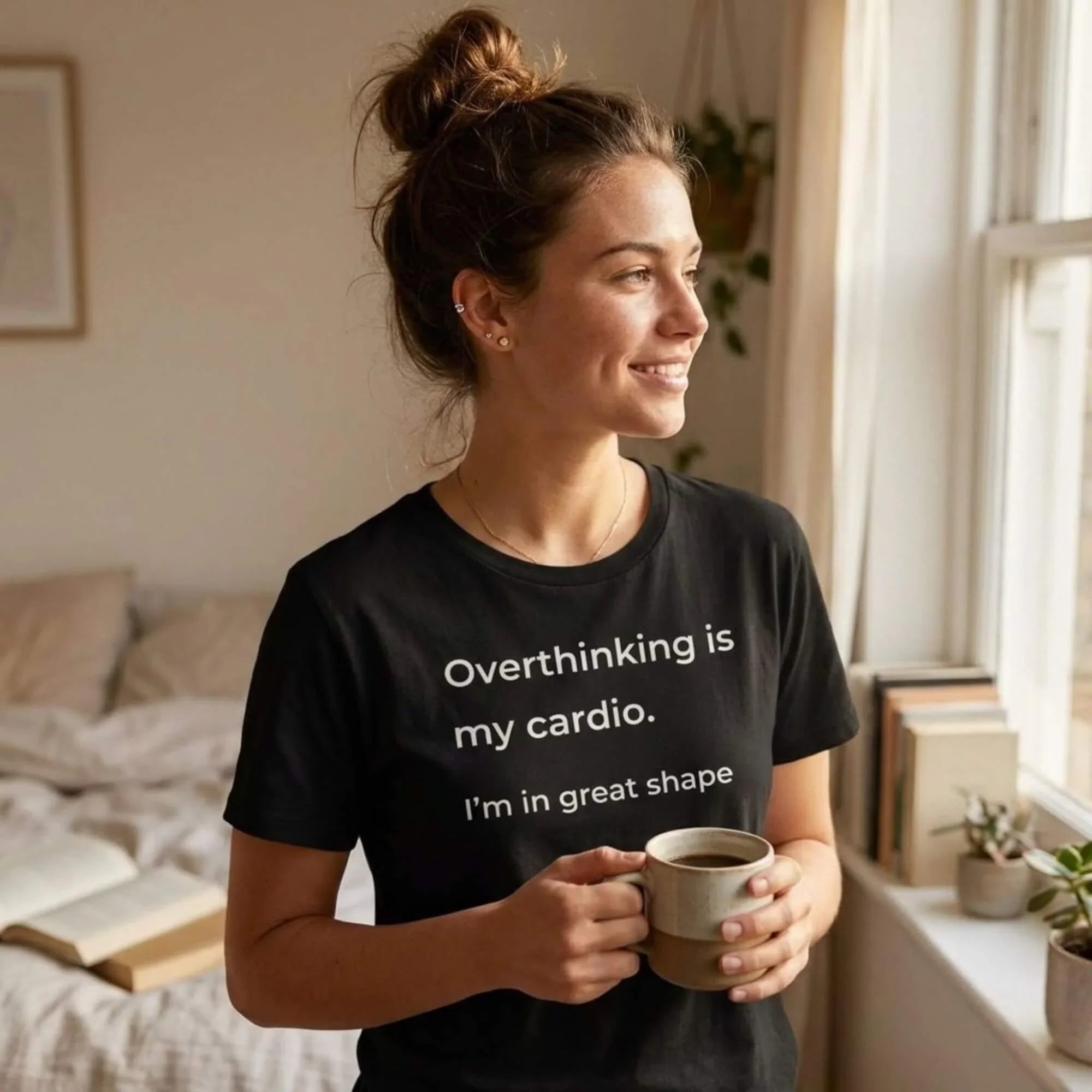 woman in overthinking is my cardio black tee holding coffee on sofa — text & tone