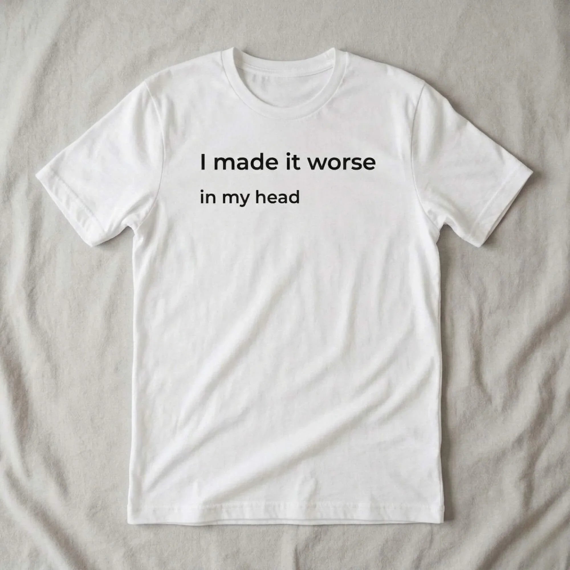 i made it worse in my head white t-shirt flat lay — text & tone