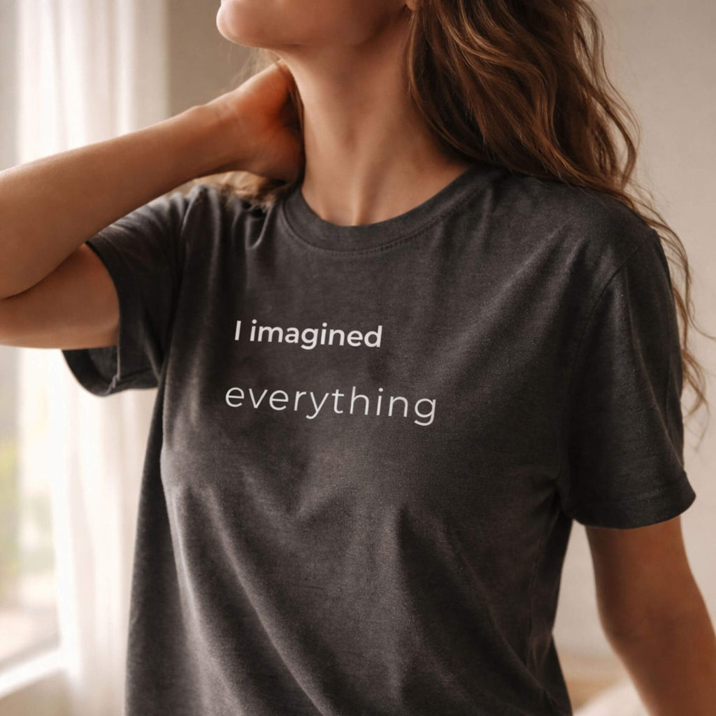 Close-up of black slogan T-shirt "I imagined everything" on female model