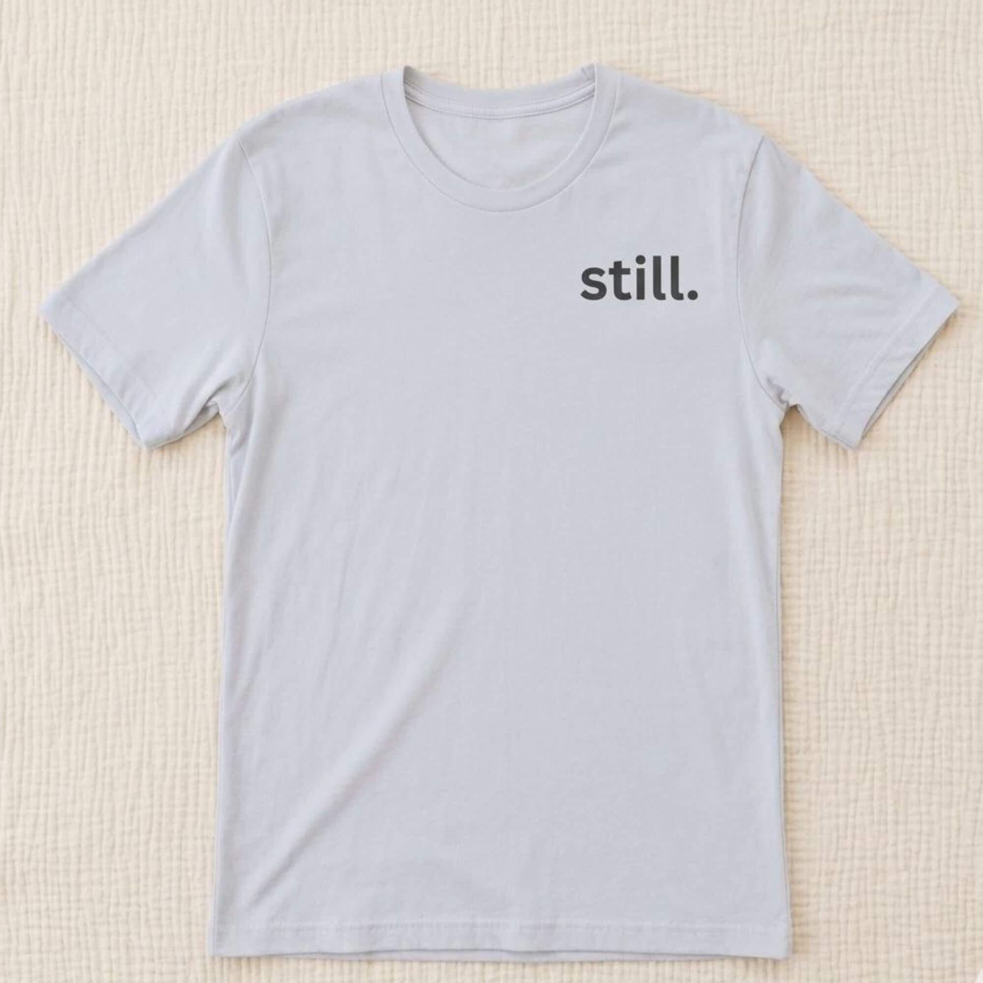 minimalist still t-shirt white flat lay clean aesthetic simple typography neutral clothing