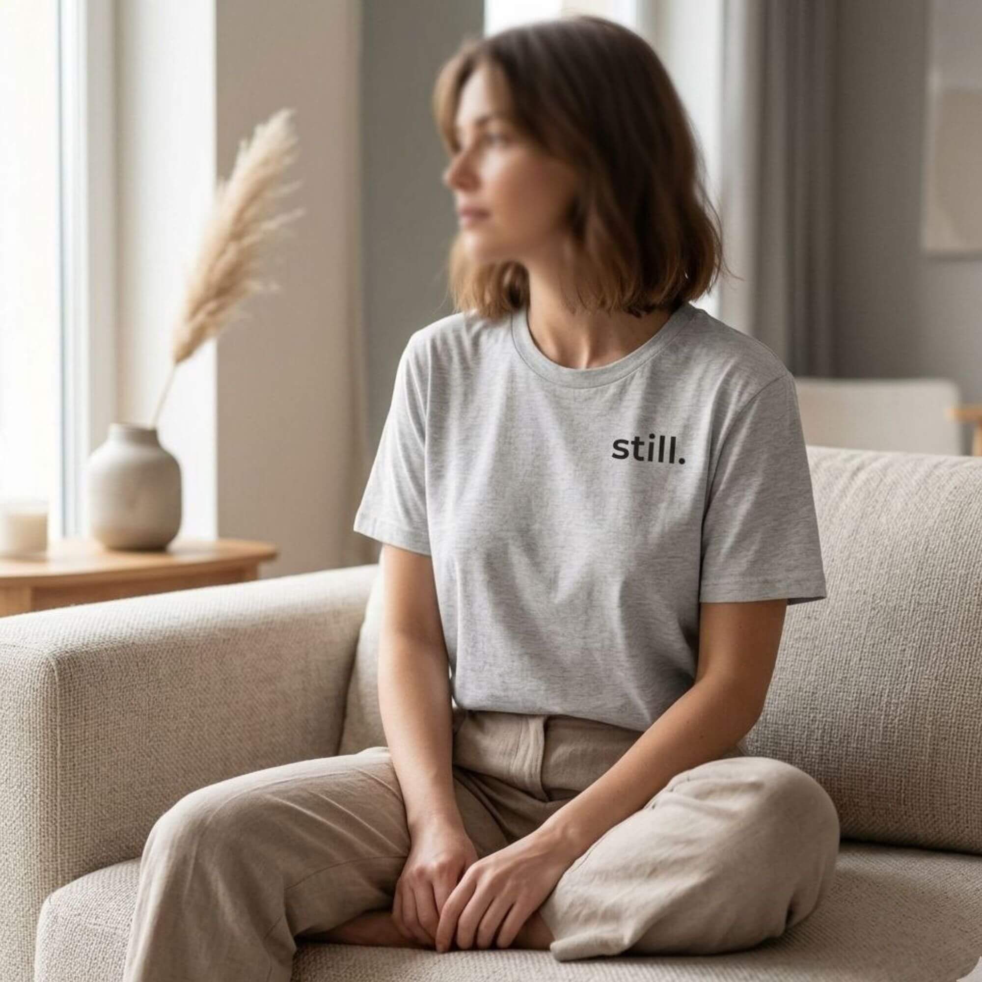 woman wearing still t-shirt soft natural light minimalist lifestyle calm aesthetic outfit