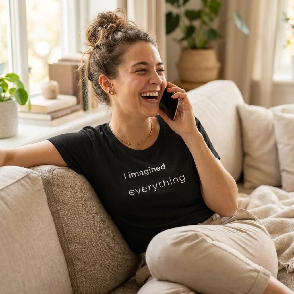 woman laughing on phone in i imagined everything dark grey tee — text & tone