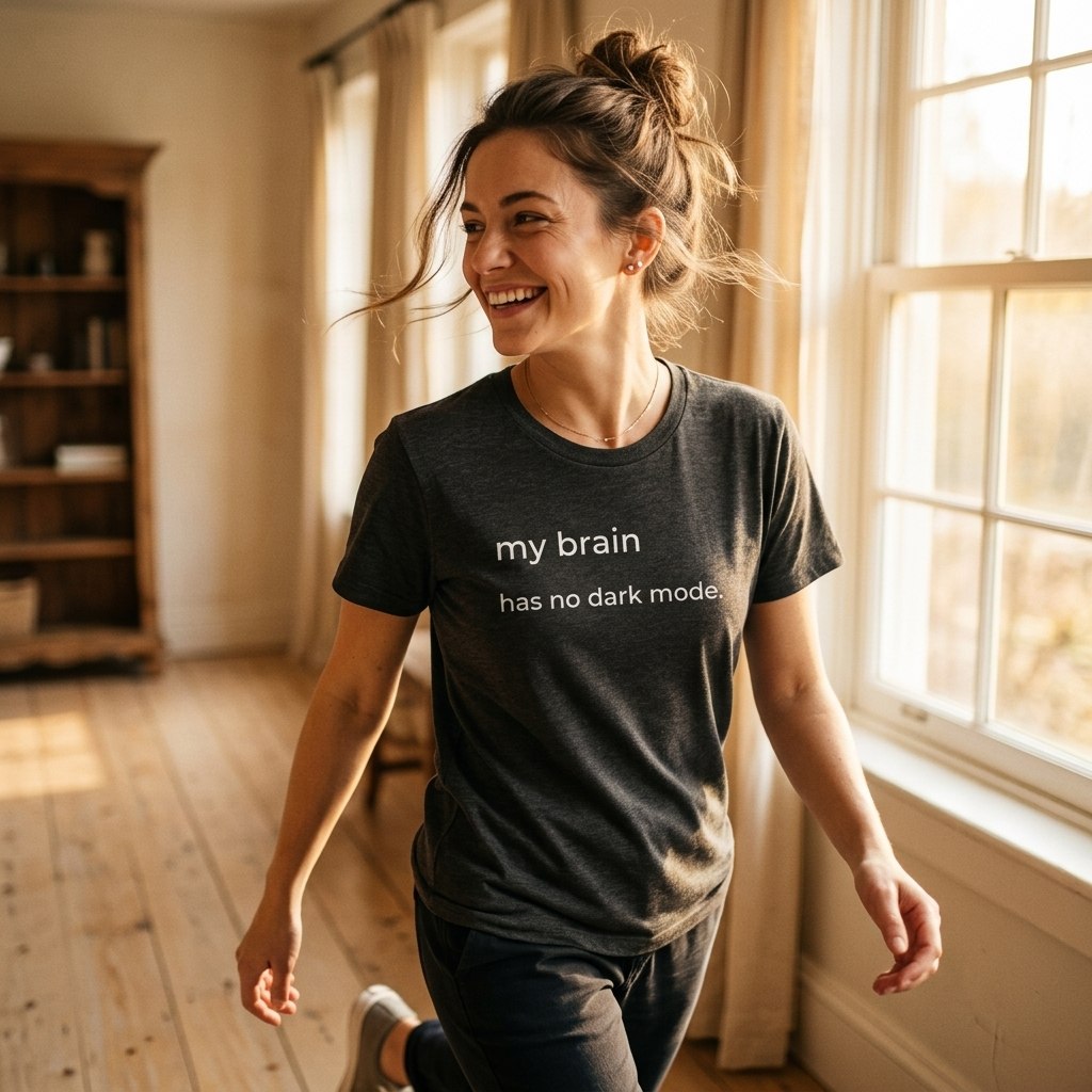 woman walking in my brain has no dark mode dark grey tee — natural light — text & tone