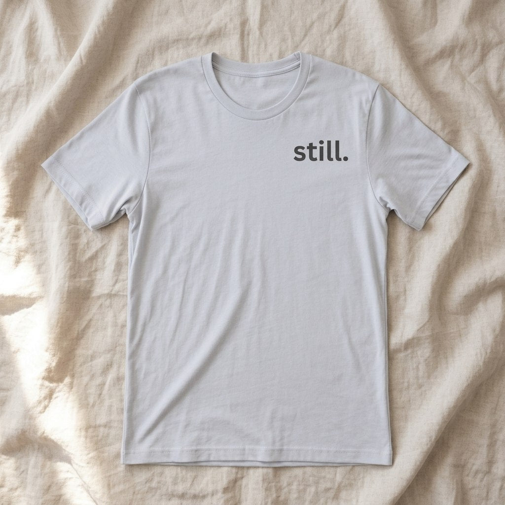 still. light blue t-shirt flat lay — text & tone
